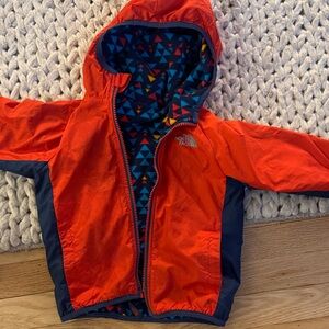 The North Face Kids' Vibrant Orange and Navy Raincoat
